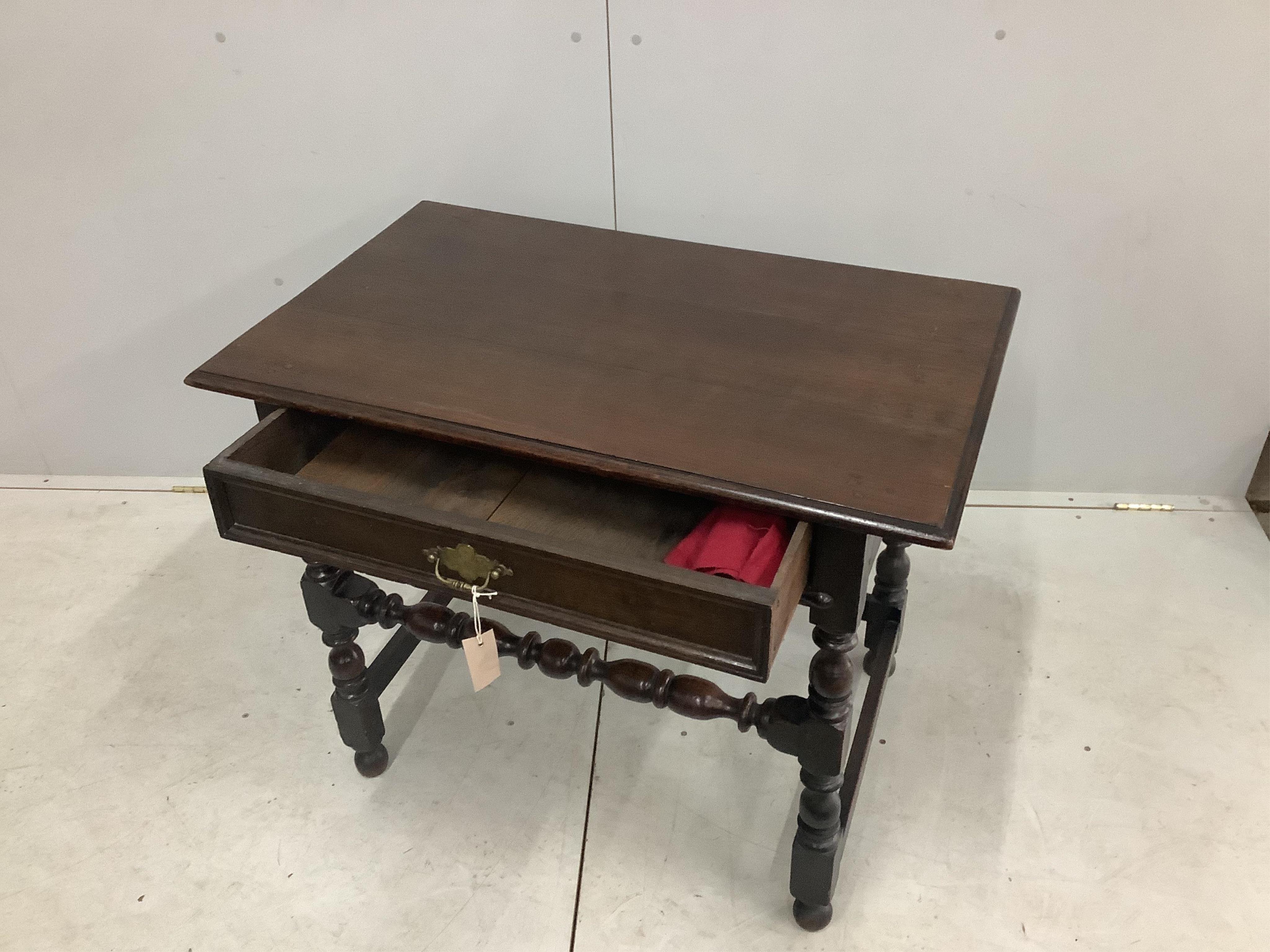 A 17th century and later oak side table, width 91cm, height 2cm. Condition - good, colour of top doesn't match underframe